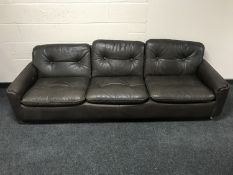 A late 20th century Danish brown leather three seater settee
