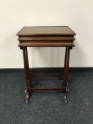 A nest of three mahogany tables with under stretchers