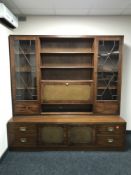 A mahogany bureau display cabinet fitted with cupboards and drawers beneath