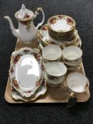 A tray containing twenty-seven pieces of Royal Albert Old Country Roses china