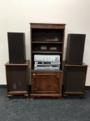 A three piece technics system on a set of Bradley bookshelves, fitted a cupboard beneath,