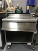 A Bonnet stainless steel catering table,