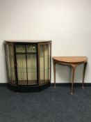 A mid 20th century teak D shaped display cabinet,