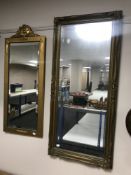 A gilt framed hall mirror and one other