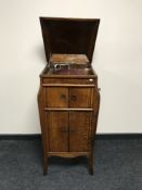 A gramophone in an oak cabinet