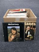 A box containing LP's including NOW albums, easy listening, Lindisfarne, Eagles,