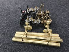 Four brass picture lights together with a basket containing three ornate brass two way light
