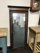 A late Victorian mahogany and walnut framed hall mirror