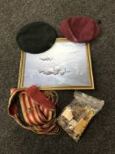 A framed print of military aircraft, a sash bearing military badges,
