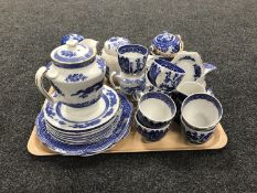 A tray of assorted Oriental style blue and white china including Wedgwood willow pattern tea cups,