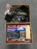 Two boxes of racing car sets and accessories