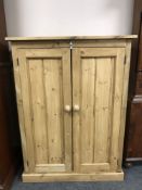 A reclaimed pine double door cabinet,