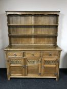 An oak triple door kitchen dresser