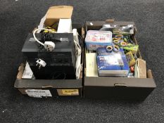 Two boxes containing games, scissors, hair clippers, steam cleaner, radios, extension leads,