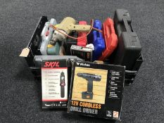 A box containing boxed and unboxed power tools, drill bits, cased drill bits,