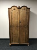 A walnut double door gentleman's wardrobe