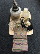 A tray containing a unframed sampler, two ladies purses, a hanging ceiling light with glass drops,