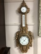 A 19th century carved oak barometer