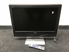 A Toshiba Regza twenty six inch LCD TV with remote