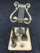 A tray containing an adjustable brass music stand, a pair of brass Corinthian column table lamps,