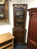 A mahogany corner display cabinet