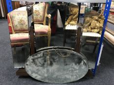 A triple dressing table mirror and two oval mirrors
