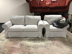 A contemporary two seater settee and armchair with loose covers,
