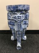 A carved wooden elephant stool,