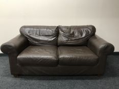 A brown leather two seater settee
