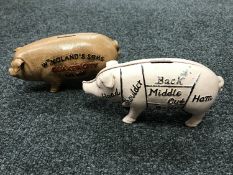 Two cast iron pig money banks