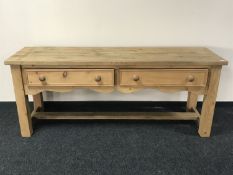 A reclaimed pine low dresser fitted two drawers