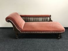 A late Victorian mahogany chaise longue upholstered in pink dralon