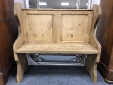 A reclaimed pine pew,