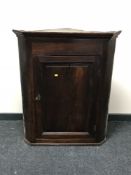 A Victorian oak hanging corner cupboard