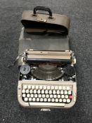 Four cased vintage typewriters