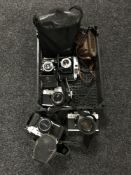 A basket of assorted cameras including Pratika TL3,