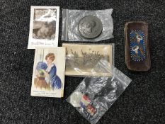 A box of vintage postcards, leather beaded glasses case,