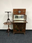 A mid twentieth century Oriental style walnut cocktail cabinet,