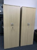 A pair of contemporary office stationary cupboards in a beech finish