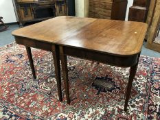 An early 19th century inlaid mahogany d-end table,