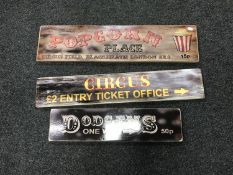 Three wooden fairground signs