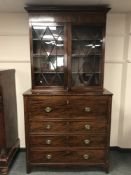 An early 19th century inlaid mahogany secretaire bookcase,