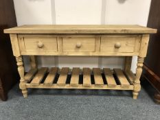 A reclaimed pine three drawer farmhouse table,
