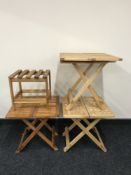 Three folding plantation teak tables and a plantation teak stool