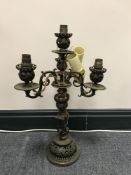 A 19th century continental brass four way table candelabrum (converted to electricity)