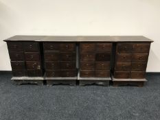 Four contemporary hard wood eight drawer chests