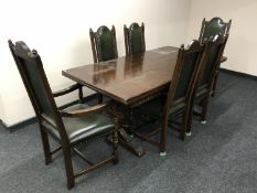 A twentieth century carved oak refectory dining table on bulbous leg supports,
