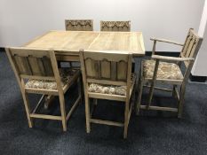 An oak refectory dining table together with five chairs (one carver and four singles)