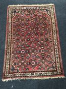 A North-West Persian rug on red ground,