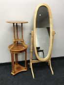 A contemporary cheval mirror in a pine finish,